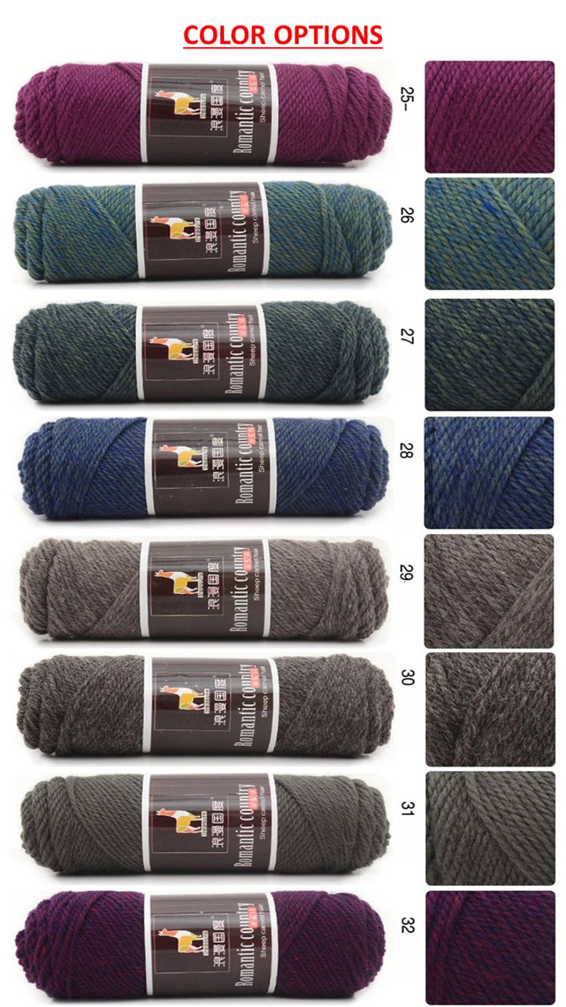 May include: A selection of yarn skeins in various colors, including purple, green, blue, gray, and brown. The yarn is labeled "Romantic Country" and "Sheep camel hair".