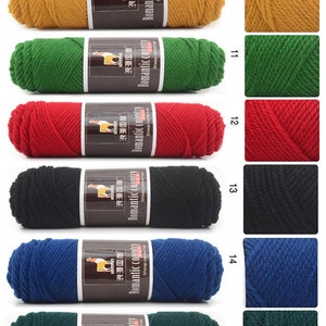 May include: A selection of yarn skeins in various colors, including red, green, blue, black, and yellow. The yarn is labeled "Romantic Country" and features a llama illustration. The skeins are arranged in rows with corresponding color swatches.