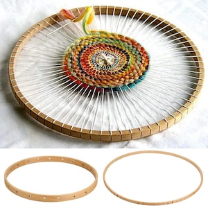 May include: Two wooden embroidery hoops, one with a colourful woven tapestry inside. The larger hoop is 12 inches in diameter and the smaller hoop is 8 inches in diameter.