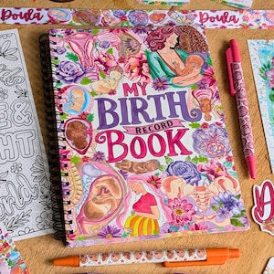 May include: A colorful birth record book with the title "My Birth Record Book" surrounded by illustrations of pregnancy and childbirth. A pink pen and other stationery items are also visible.