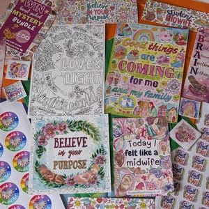 May include: A collection of printed paper stationery including coloring pages, bookmarks, and stickers. Items feature illustrations of fetuses, floral wreaths, and text such as Good things are coming for me and my family, Love & Light, and Student Midwife.