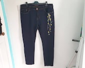 Yellow flower hand painted design on plus size indigo skinny jeans
