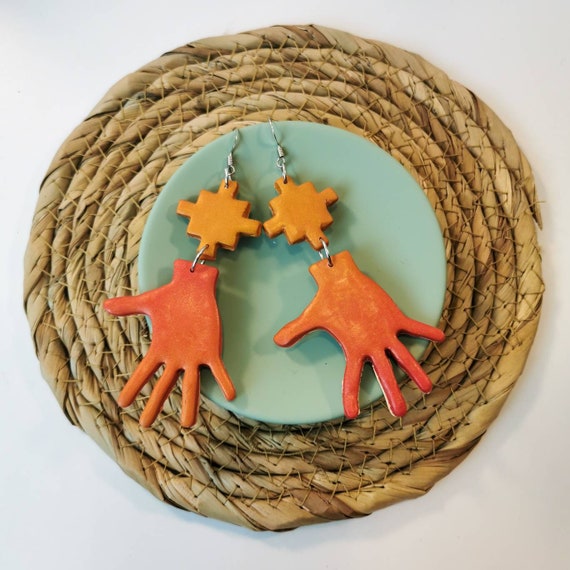 Quirky, hand shaped, drop earrings in sunset orange and red colours. Lightweight, long and nickel free, made out of polymer clay