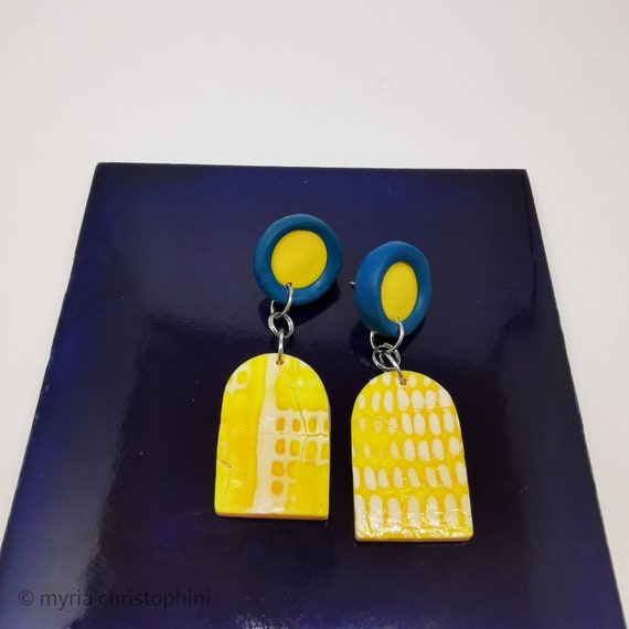 Yellow and blue arched earrings