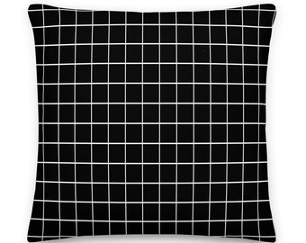 Almohada de rayas blancas y negras