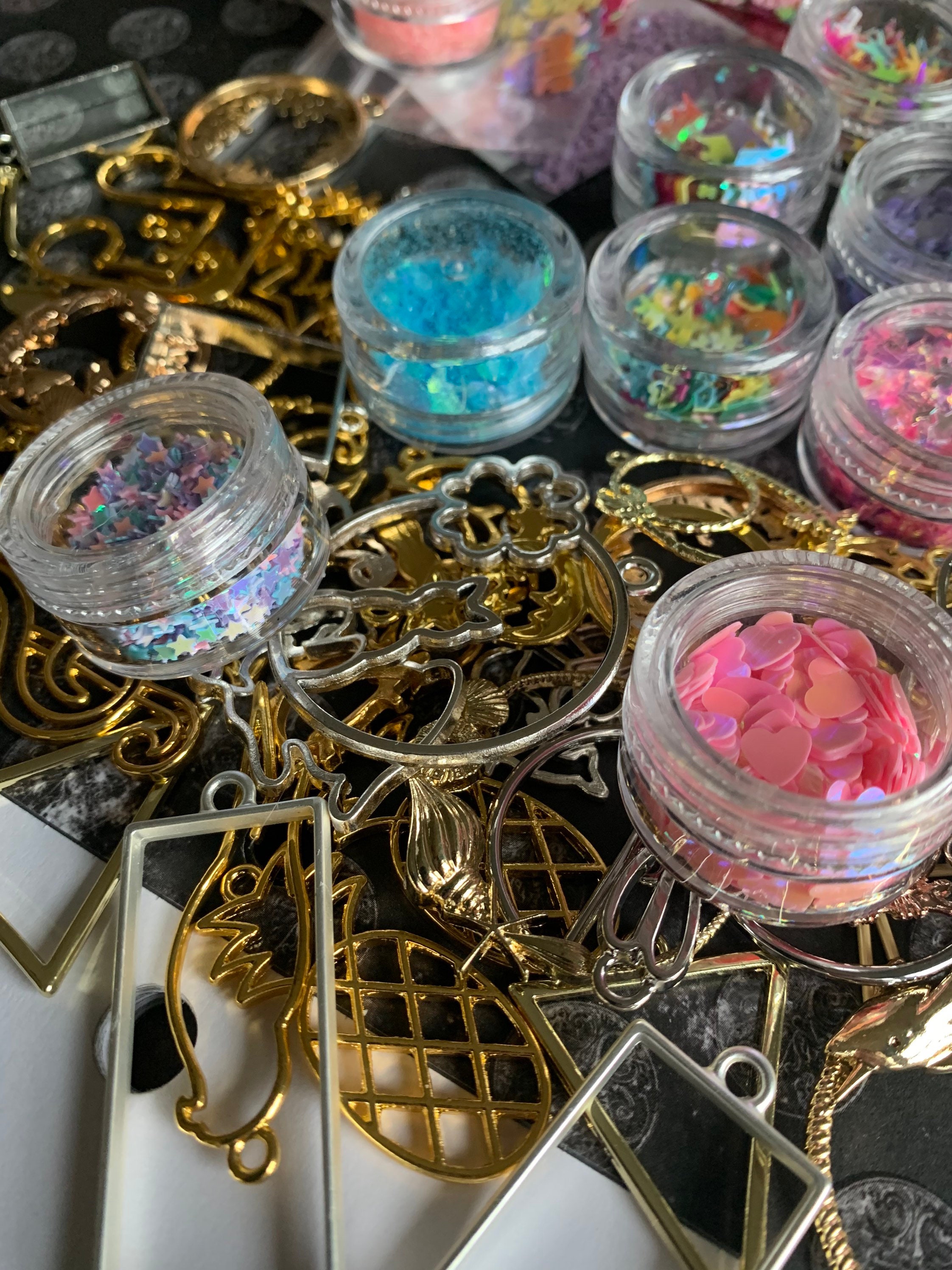 An awesome ten pack of mystery glitter and bezel packs. Etsy