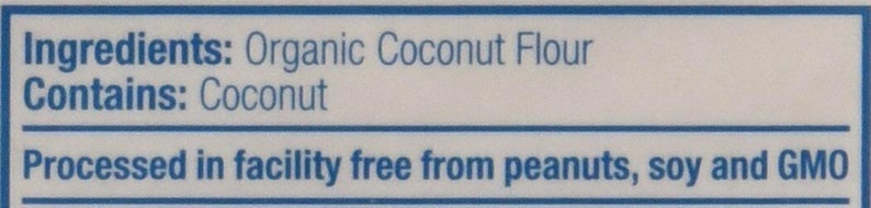 Puede incluir: Una etiqueta azul y blanca con el texto "Ingredientes: Harina de coco org&aacute;nica" y "Contiene: Coco". La etiqueta tambi&eacute;n indica "Procesado en una instalaci&oacute;n libre de cacahuetes, soja y OMG".