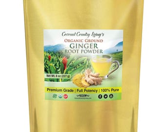 May include: A gold-colored stand-up pouch containing Coconut Country Living's Organic Ground Ginger Root Powder. The label displays a net weight of 8 oz, a cup of ginger tea, fresh ginger root, and green foliage in a mountain landscape.