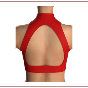 May include: A red sleeveless top with a high neckline and a large keyhole opening in the back.