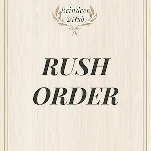 May include: A white background with a brown woodgrain pattern. The text "Reindeer & Hub" is in a brown font with a laurel wreath design. The text "Rush Order" is in a black font.