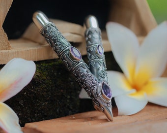 Handcrafted 99% Pure Silver ornament kuripe  decorated with Amethyst stone and Tamarind wood inside