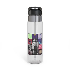 May include: A clear plastic water bottle with a silver lid and a black cap. The bottle has a colorful image of a nutcracker and other holiday-themed images.