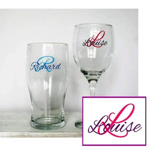 May include: Two clear glass cups with personalised names. The larger cup has the name "Richard" in blue lettering. The smaller cup has the name "Louise" in red lettering. A separate image shows the name "Louise" in a pink and purple cursive font.