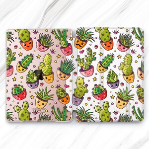 May include: Two iPad cases with a white background and a pattern of colorful cartoon cacti and succulents in pots. The cacti and succulents have smiling faces.