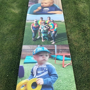 May include: A collage of three photos featuring a young child in different settings. The top photo shows the child wearing a blue shirt with a cupcake graphic and sitting in a blue chair. The middle photo shows the child with a group of adults wearing tie-dye shirts. The bottom photo shows the child wearing a blue jacket with a Nike logo and a blue hat, holding two yellow rings.