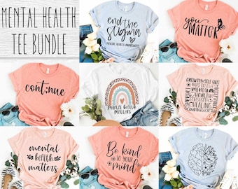 Könnte beinhalten: Ein Bündel von 10 T-Shirts mit verschiedenen Slogans zur Sensibilisierung für psychische Gesundheit. Die Shirts sind in verschiedenen Farben, darunter Pink, Blau und Weiß. Die Slogans lauten "continue", "end the stigma", "you matter", "mental health matters", "mental health matters", "Be kind to your mind" und "growth, soul, girl, naps, brave, mental health, acceptance, support, courage, worth, healing, strength".
