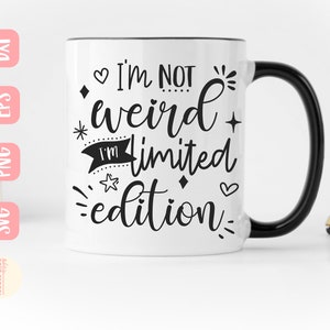 May include: White ceramic mug with a black handle. The mug has black text that reads "I'm not weird I'm limited edition" with a heart, star, and diamond graphic.