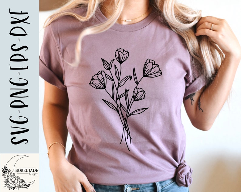 May include: A purple t-shirt featuring a black line drawing of a bouquet of flowers. The flowers are stylised and have a simple design.