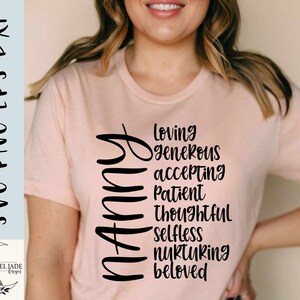 May include: A pink t-shirt with the word "Mommy" spelled vertically in black. The word is surrounded by a list of positive adjectives, including "loving", "generous", "accepting", "patient", "thoughtful", "selfless", "nurturing", and "beloved".