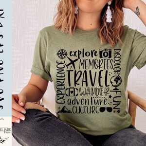 May include: A green t-shirt with black text that says "EXPERIENCE explore MEMORIES TRAVEL WANDER adventure.. CULTURE" with a compass, airplane, camera, globe, suitcase, and sunglasses graphic.