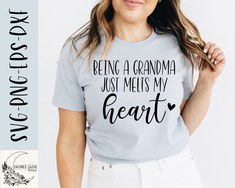 May include: A light blue t-shirt with the text "Being a grandma just melts my heart" in black lettering with a small heart symbol.
