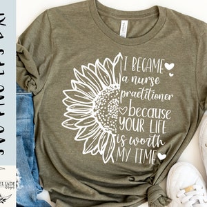 May include: Olive green t-shirt with a white sunflower design on the left side and the text "I became a nurse practitioner because your life is worth my time." The shirt is paired with blue jeans and white sneakers.