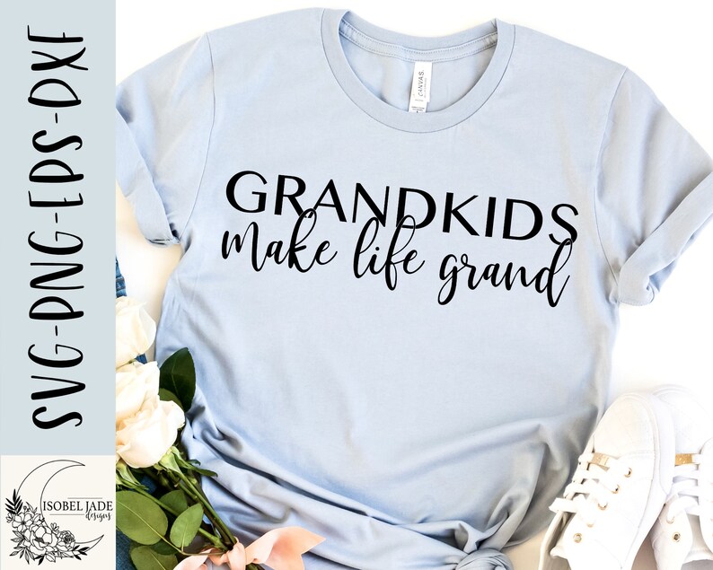 May include: A light blue t-shirt with the text "Grandkids make life grand" printed in black.