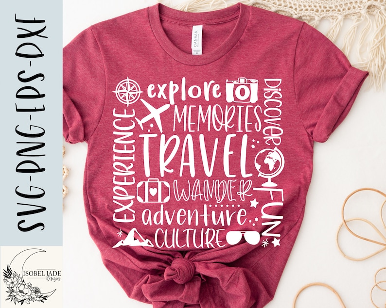 May include: Red t-shirt with white text that reads "EXPERIENCE", "explore", "MEMORIES", "TRAVEL", "DISCOVER", "FUN", "WANDER", "adventure", "CULTURE". The text is arranged in a circle around the word "TRAVEL".