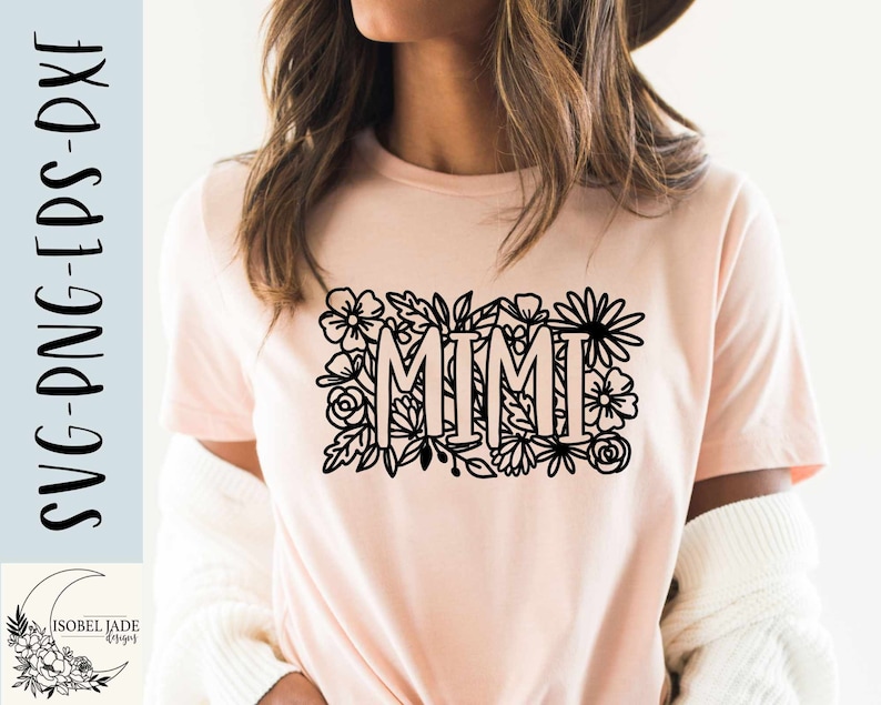 May include: A pink t-shirt with a black floral design and the word "MIMI" in the center.
