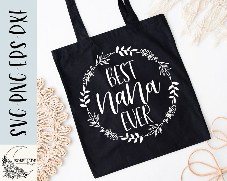 May include: Black tote bag with white text that reads "Best Nana Ever" surrounded by a floral wreath.