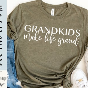 May include: A green t-shirt with the text "Grandkids make life grand" in white lettering.