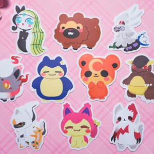 May include: A set of ten cartoon character stickers featuring a variety of animals, including a bear, a fox, a cat, and a dragon. The stickers are printed on white paper and have a glossy finish.