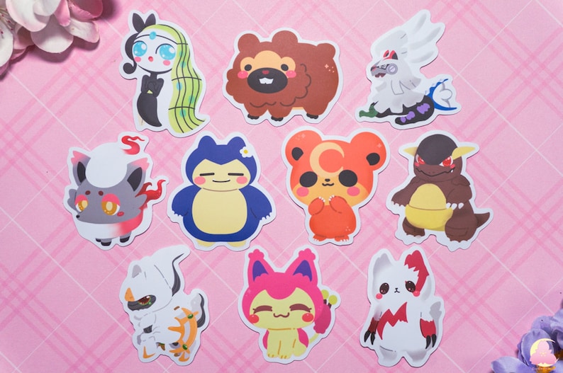 May include: A set of ten cartoon character stickers featuring a variety of animals, including a bear, a fox, a cat, and a dragon. The stickers are printed on white paper and have a glossy finish.