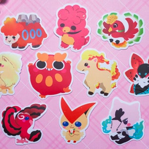 May include: Ten colorful cartoon stickers featuring various fire-type Pokemon. The stickers are printed on white paper and feature a variety of poses and expressions.