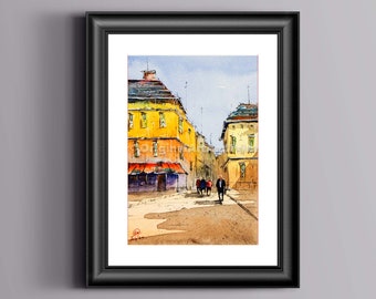 May include: A framed watercolor painting depicting a European street scene with yellow buildings, a red awning, and several figures walking on a paved square. The artwork is enclosed in a black frame with a white mat, showcasing a bright, sunny day.
