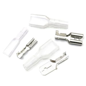 May include: Assortment of clear plastic wire connectors with metal terminals. The connectors are used to connect wires together.