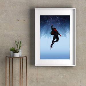 May include: A framed poster featuring a stylized illustration of a superhero in a red and black suit, with a green jacket, jumping in front of a city skyline. The city is upside down, with the sky in the background.
