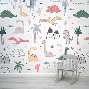 May include: A white wall with a repeating pattern of colorful dinosaurs, palm trees, and mountains. The pattern is a whimsical and fun design for a child's room.