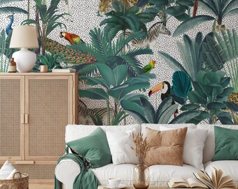 May include: A white couch with green and brown throw pillows in front of a jungle-themed wallpaper. The wallpaper features toucans, peacocks, zebras, leopards, and palm trees.