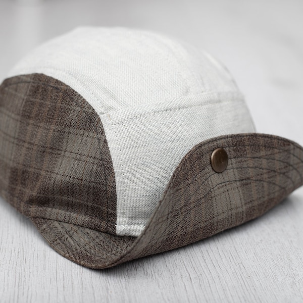 Handmade five panel hat with soft flip up brim. Unstructured cap with metal button. Limited edition