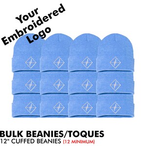May include: A bulk pack of 12 light blue beanies with a white embroidered logo. The beanies are 12 inches long and have a cuffed design. "BULK BEANIES/TOQUES 12" CUFFED BEANIES (12 MINIMUM)" is written in black text at the bottom of the image.