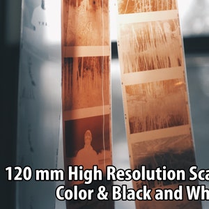 May include: Close-up of 120 mm film negatives hanging on a window. The negatives show images of trees and a person. The text "120 mm High Resolution Scans Color & Black and White" is visible at the bottom of the image.
