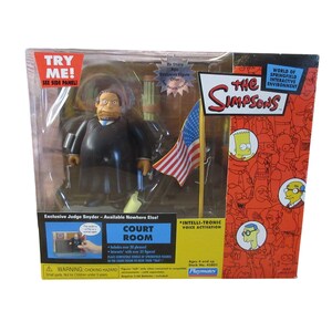 May include: The Simpsons Judge Snyder action figure in original packaging. The figure is wearing a black robe and holding a gavel. The packaging includes the American flag and the words "Court Room".