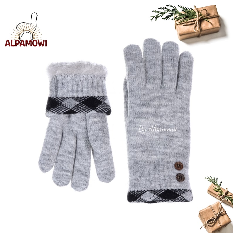 May include: A pair of gray knit gloves with black and white plaid trim and brown buttons. The gloves are touchscreen compatible and have a fleece lining for warmth. By Alpamoowi.