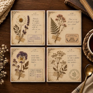 May include: A set of four square coasters featuring vintage-style paper designs with pressed flowers, library card motifs, and literary quotes. Each coaster displays unique botanical specimens, including daisies, ferns, pansies, and baby's breath.