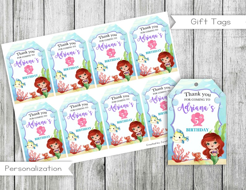 May include: Set of 8 printable gift tags featuring a mermaid with red hair and a purple tail. The tags are decorated with a blue and white background with bubbles and coral. The text on the tags reads "Thank you for coming to Adriana's 5th Birthday".