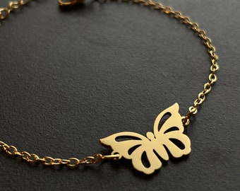 Gold-colored bracelet with butterfly motif made of stainless steel and adjustable snap fastener, perfect gift for birthday for girlfriend