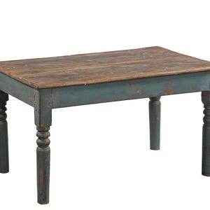 May include: A rectangular wooden table featuring a natural brown wood grain top and a distressed blue painted base. The table is supported by four turned legs that exhibit signs of wear and paint chipping, revealing the underlying wood texture.