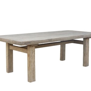 May include: A rectangular, light-colored wooden coffee table with a distressed finish. The table has a simple design with four sturdy legs and a lower support beam. The table measures approximately 60 inches long, 30 inches wide, and 18 inches high.