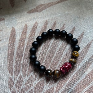 Cinnabar Buddha Carved Bead with Tigers Eye and Matte Black Onyx 10mm Beaded Bracelet